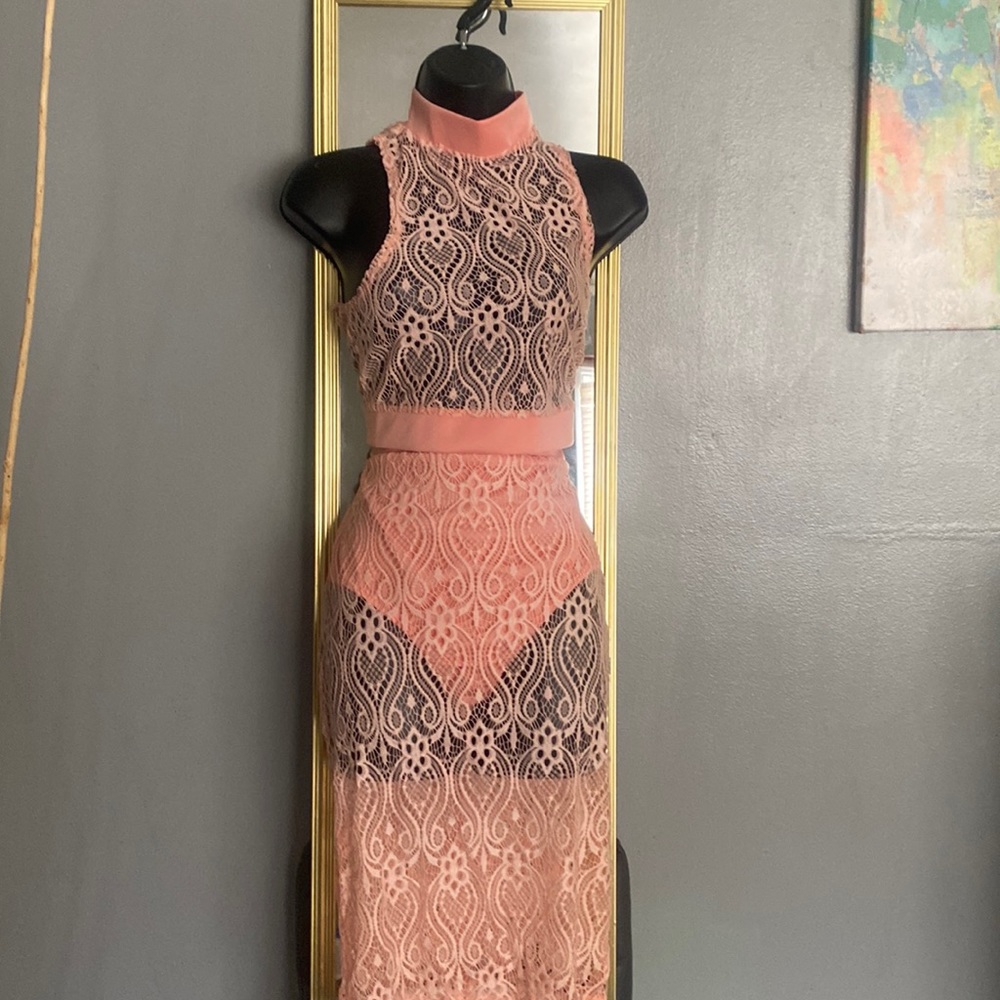 2 Piece Lace Set . Skirt comes with attached briefs . Crop top zipper back